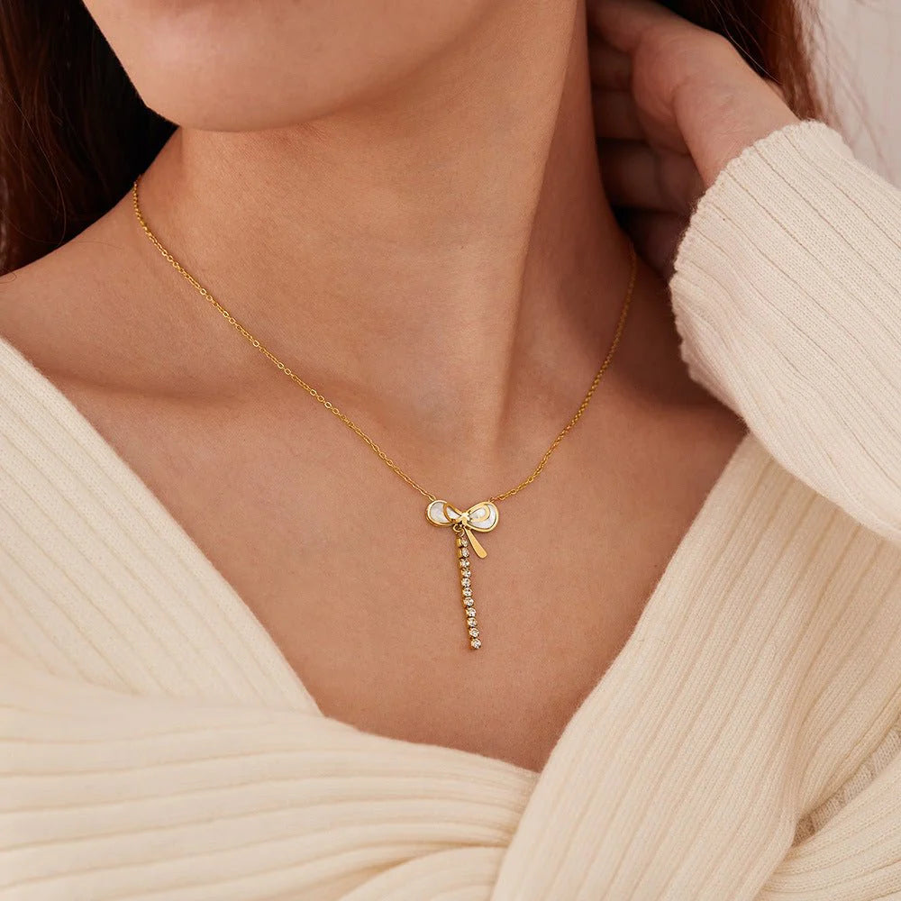 Luxury Mother of Pearl Bow Necklace with Crystal Tassel – Titanium Steel