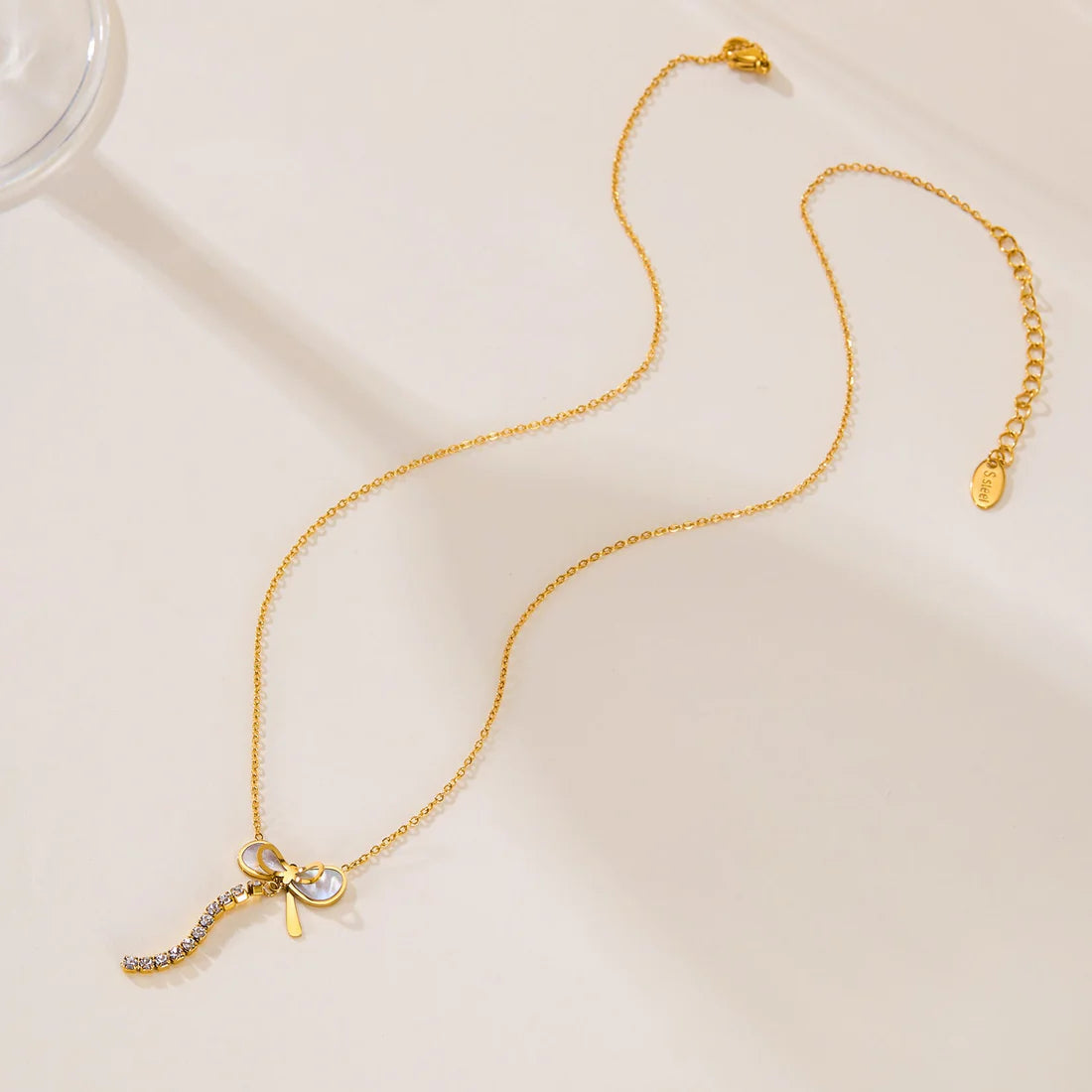 Luxury Mother of Pearl Bow Necklace with Crystal Tassel – Titanium Steel