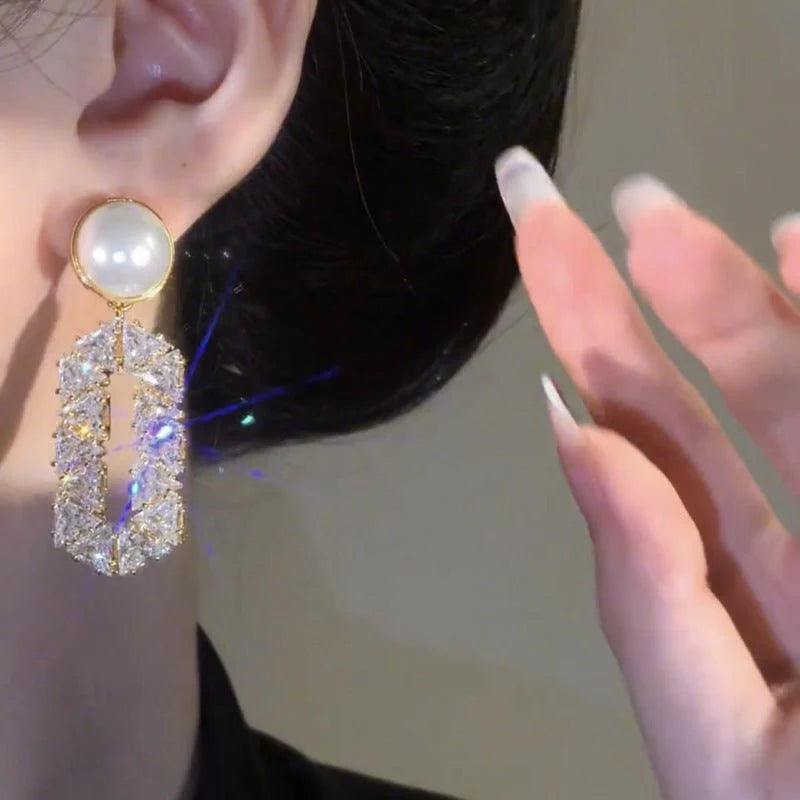 Exclusive Oval Diamond Drop Earrings with Refined Pearl Elegance